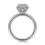 Elegant engagement ring with a sparkling diamond and intricate setting in platinum or white gold.