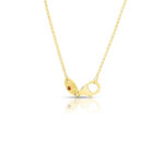 Elegant gold necklace with small links and a decorative red stone clasp, perfect for any occasion.