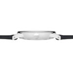 NOMOS minimalist watch featuring polished stainless steel case and leather strap for timeless elegance.