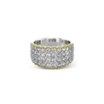 Elegant silver and gold ring with sparkling gemstones, showcasing luxury and intricate craftsmanship.