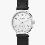 Minimalist NOMOS Glashütte watch with elegant design, stainless steel case, and black leather strap.