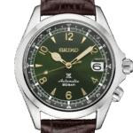 Elegant Seiko watch with green dial, stainless steel case, and brown leather strap.