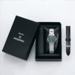 Elegant Seiko watch in luxury packaging with green dial and additional leather strap.