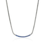 Elegant silver necklace with gradient blue gemstones, perfect for casual or formal occasions.