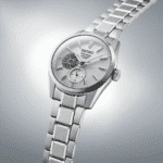 Seiko Presage watch with a tourbillon, textured dial, and polished stainless steel bracelet.