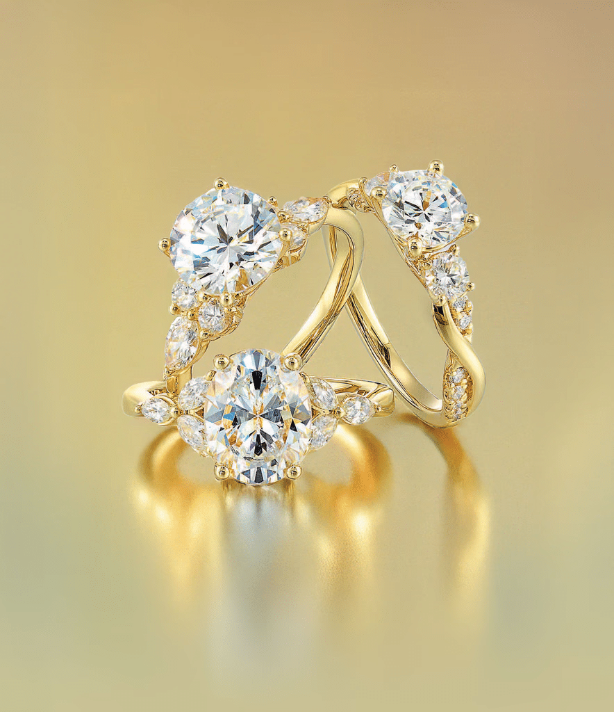 Elegant gold ring with three sparkling stones, perfect for a statement jewelry piece.