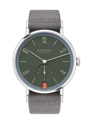 NOMOS Glashütte watch, minimalist design, deep green dial, stainless steel, elegant fabric strap.