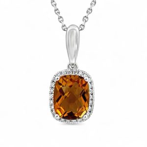 Elegant golden-orange gemstone pendant with diamonds in white gold setting, perfect for any occasion.