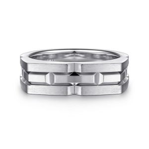 Contemporary interlocking ring in polished metal with geometric design and layered textures.