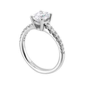 Elegant oval-cut diamond engagement ring with pave-set smaller diamonds in a luxurious white metal band.