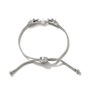 Elegant silver dragon bracelet with pearl accents and intricate details, perfect for any occasion.