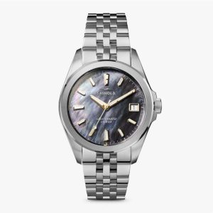 Elegant Shinola watch with iridescent mother-of-pearl dial and polished stainless steel bracelet.