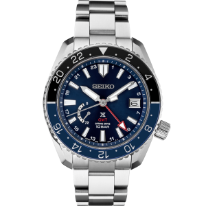 Stylish Seiko watch with blue dial, GMT hand, and stainless steel bracelet for travelers.