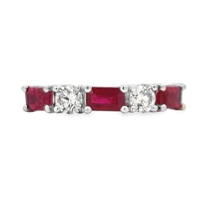 Elegant ring featuring red rubies and sparkling diamonds in a white gold setting.