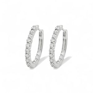 Elegant silver hoop earrings with sparkling gemstones, perfect for day or evening wear.