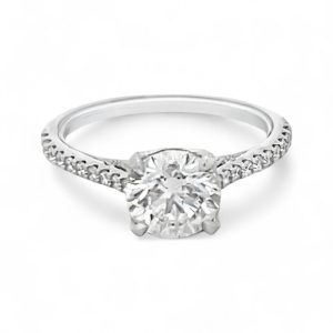 Elegant engagement ring with a brilliant diamond in a classic white gold band.