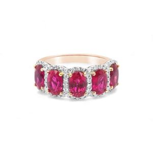 Stunning pink oval gemstone ring in rose gold with diamond halo accents, perfect for special occasions.