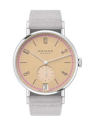 NOMOS Glashütte watch features minimalist design, warm beige dial, and elegant stainless steel case.