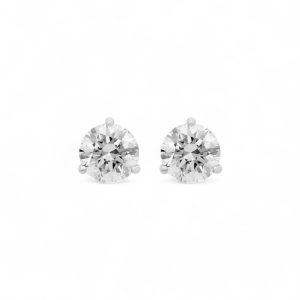 Elegant diamond stud earrings in a polished white metal setting, showcasing timeless brilliance and luxury.