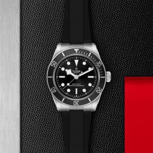Tudor dive watch with black dial and rubber strap, showcasing style and functionality.