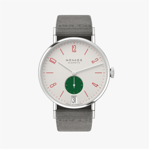 Minimalist NOMOS Glashütte watch features red numerals, green sub-dial, and gray fabric strap.