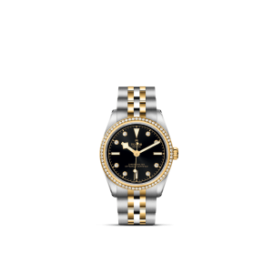 Luxurious Tudor watch featuring a black dial, golden accents, and a two-tone bracelet.