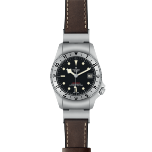 Durable Tudor watch with stainless steel case, black dial, and brown leather strap for adventurers.
