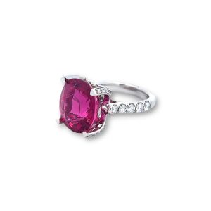 Elegant pink gemstone ring with diamonds, perfect for engagement or special occasions.