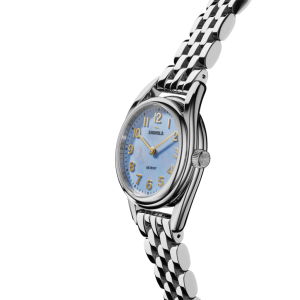 Elegant Shinola watch with light blue dial and stainless steel bracelet, perfect for any occasion.