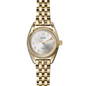 Elegant gold Shinola wristwatch with a polished finish and stylish textured bracelet.