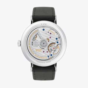 Elegant mechanical watch with transparent case back, stainless steel, and black leather strap.