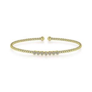 Elegant gold bracelet with sparkling gems, perfect for any occasion or outfit.