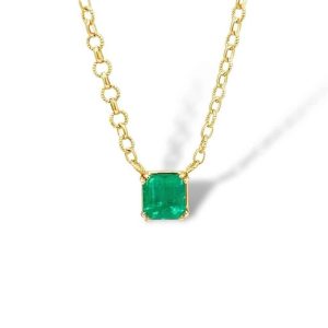 Elegant gold necklace featuring a stunning emerald gemstone, perfect for any occasion.