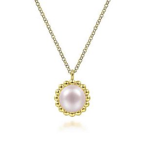Elegant pearl necklace with gold setting, featuring a lustrous pink pearl and intricate design.