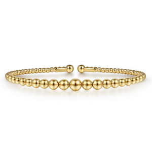 Elegant gold bracelet with alternating spherical beads, perfect for stacking or solo wear.