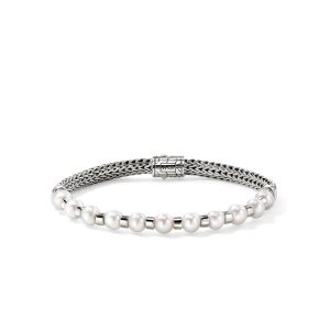 Elegant silver braided bracelet with white pearls and a modern geometric clasp.