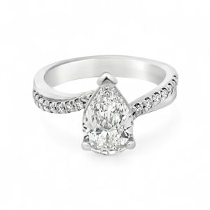 Stunning pear-shaped diamond ring with accent stones in a sleek, modern band design.