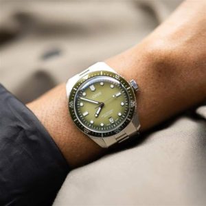 Stylish Oris wristwatch with an olive green dial and stainless steel bracelet.