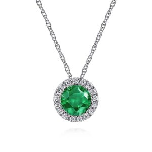 Elegant emerald necklace with diamond halo, perfect for luxurious occasions or as a statement piece.