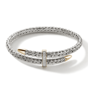 Elegant silver bracelet with diamond embellishments and gold accents, perfect for any occasion.