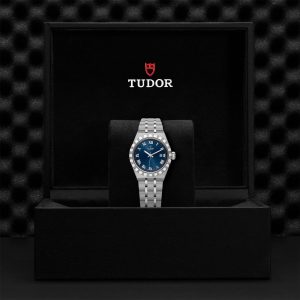 Tudor luxury watch in elegant presentation box with deep blue dial and stainless steel bracelet.