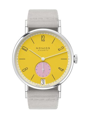 NOMOS Glashütte watch with vibrant yellow dial, pink sub-dial, and gray textile strap.