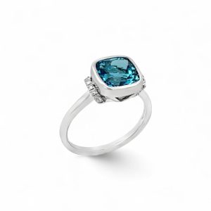Elegant blue cushion-cut ring with diamonds, perfect for engagement or special occasions.