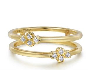 Elegant gold rings with floral motifs and diamonds, perfect for engagement or anniversary gifts.