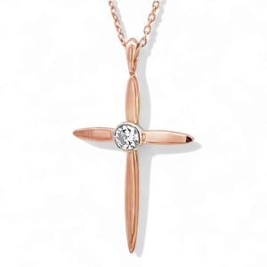 Rose gold cross pendant with diamond, elegant chain, perfect for faith and fashion.