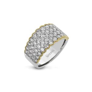 Elegant diamond ring in white metal with yellow gold accents, showcasing exquisite craftsmanship.