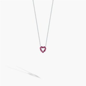 Elegant heart-shaped pendant necklace with vibrant pink stones on a polished silver chain.