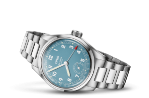 Oris Big Crown watch features a turquoise dial, polished stainless steel case, and elegant design.