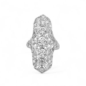 Vintage white gold ring with diamonds, showcasing intricate craftsmanship and timeless elegance.