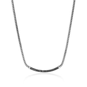 Elegant silver necklace with bold pendant and black gemstone accents for modern sophistication.